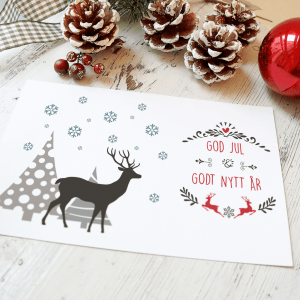 Julekort reinsdyr - Et eksempel på forsiden til julekort med reinsdyr, juletre og snø - God jul og godt nyttår